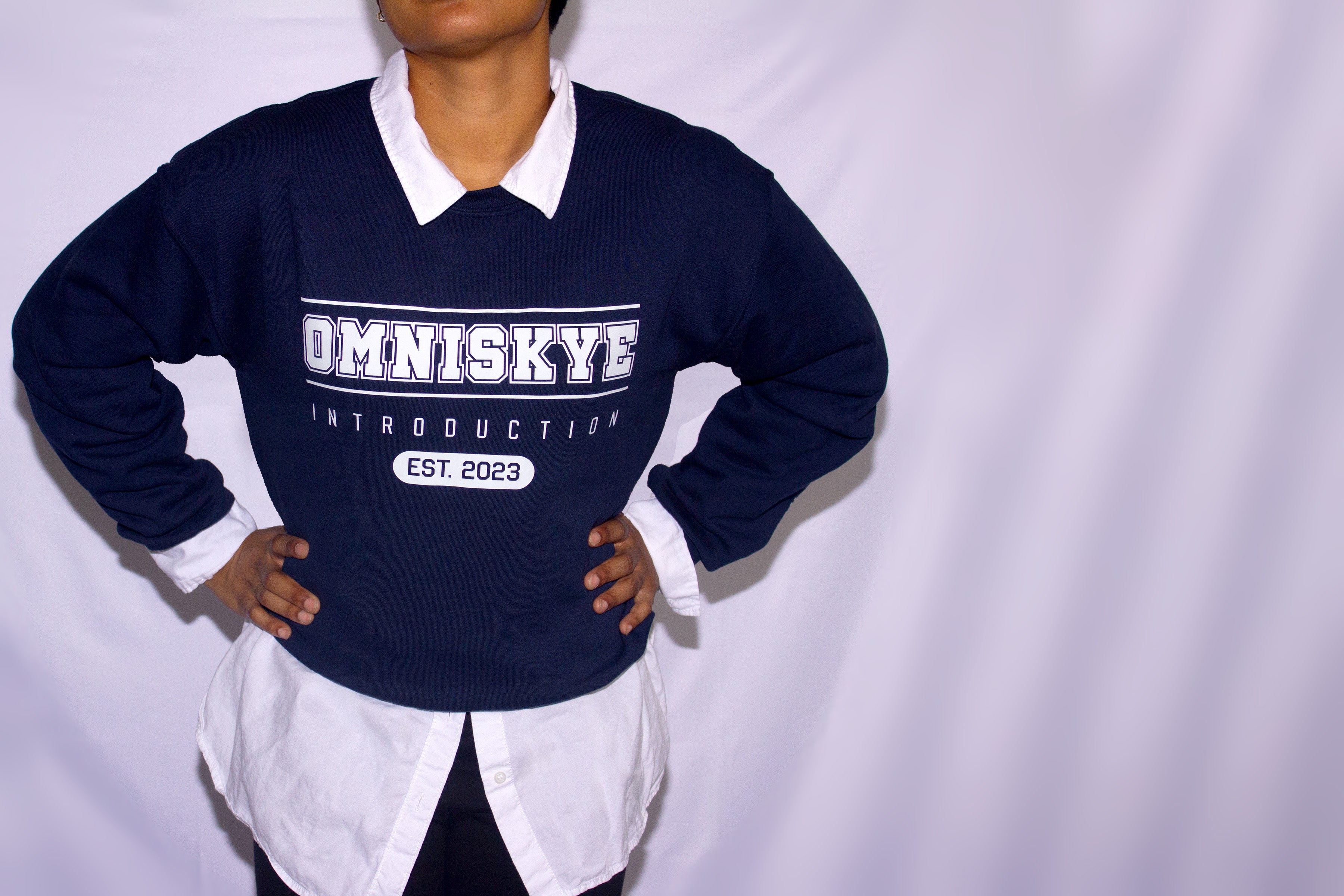Blue Sweatshirt. Text: OmniSkye Introduction Est. 2023